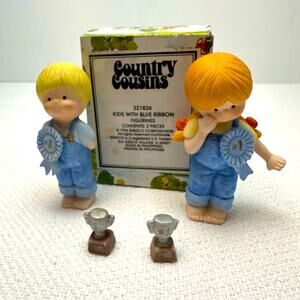 Enesco Country Cousins 321826 kids with blue ribbons